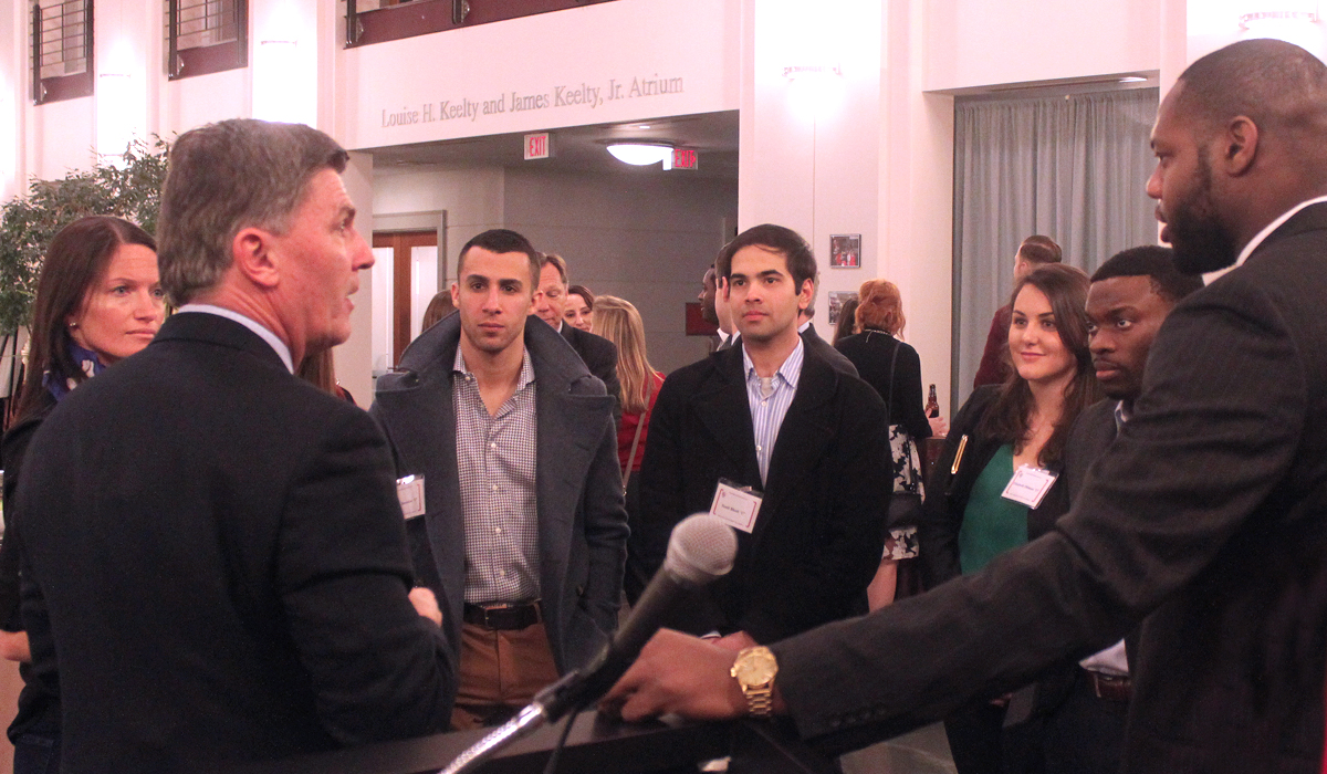 students in the law school atrium talking to governor ehrlich