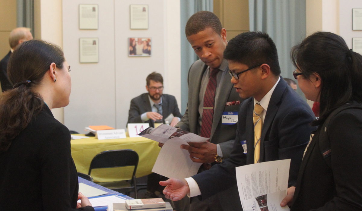 students at a job fair in the law school atrium