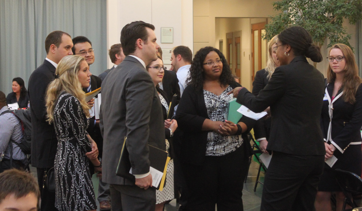 students at a job fair in the law school atrium