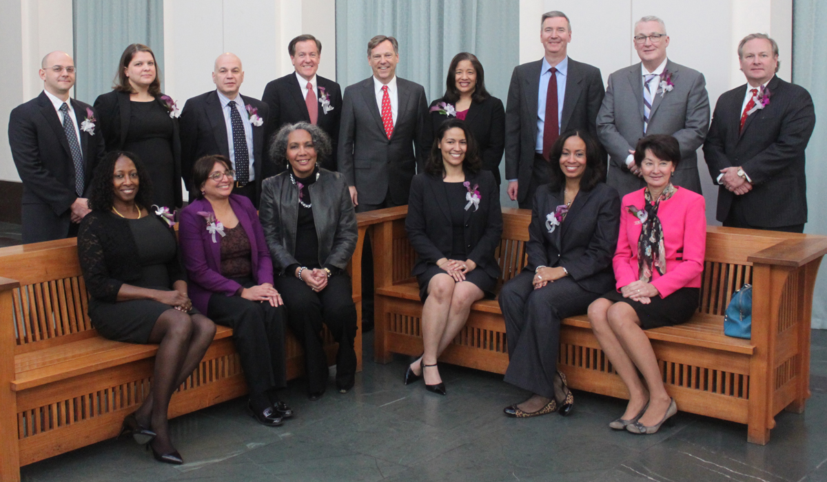 alumni pose for a photo in the law school atrium