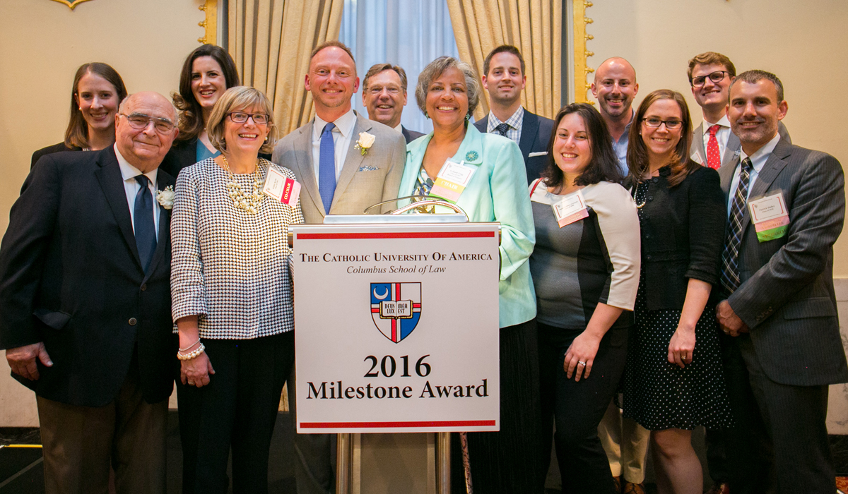 Group of alumni posing for a photo at the law and technology pay it forward awards