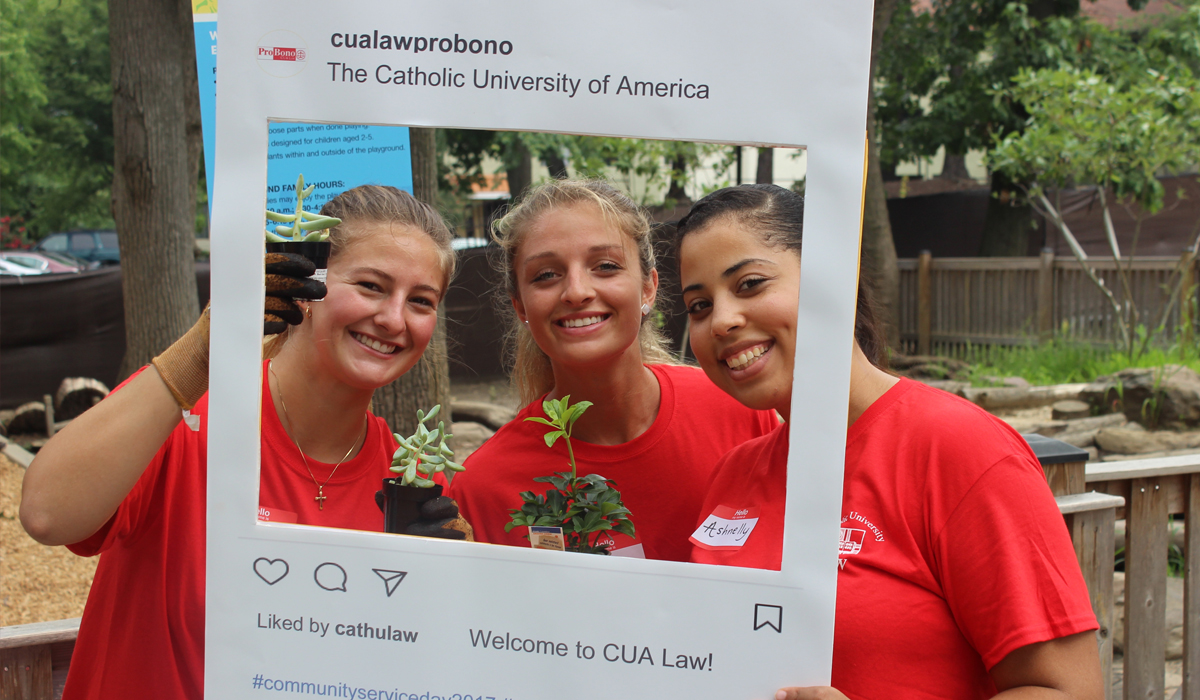 students holding up a I Do Probono sign