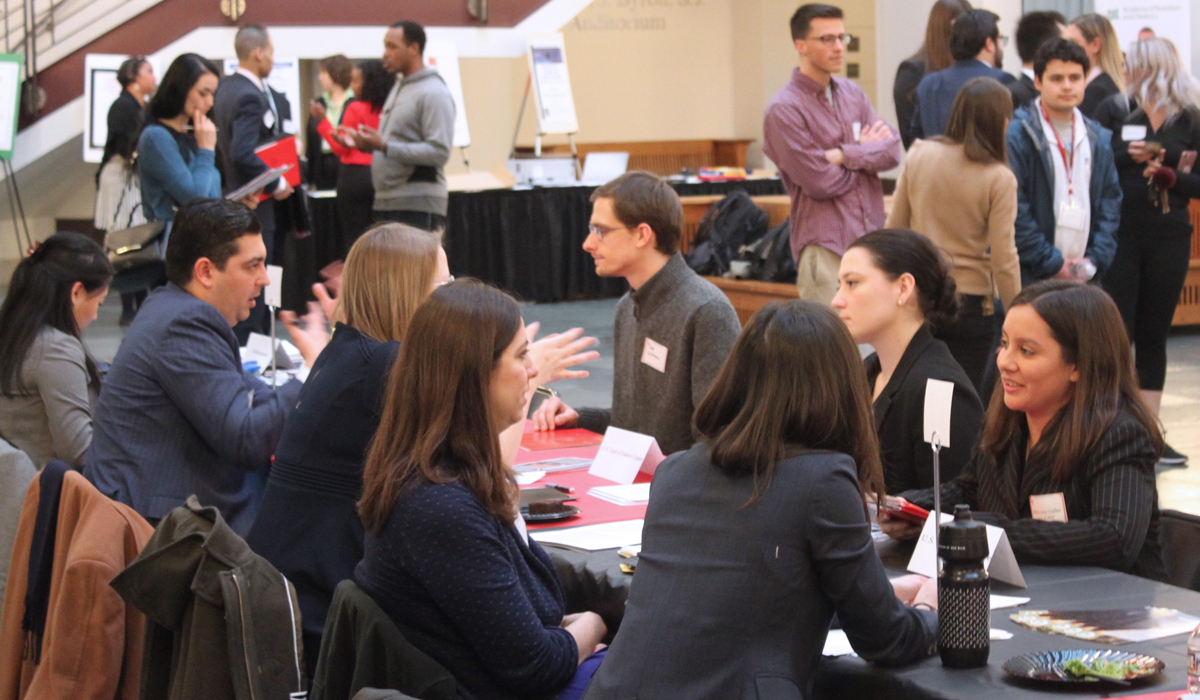 students at a job fair in the law school atrium