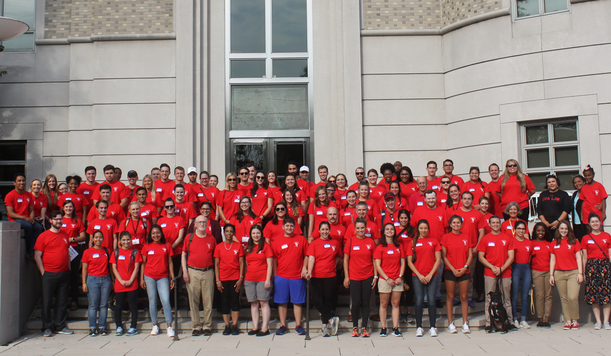 group of students standing outside of the law school