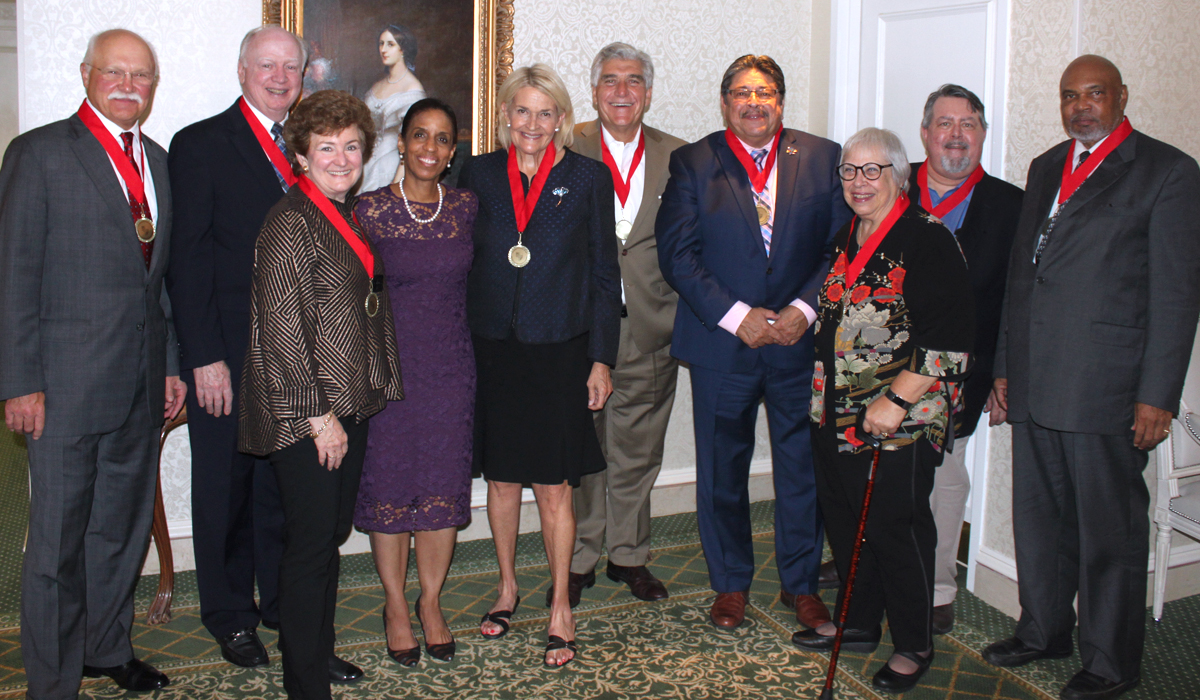 group of alumni posing for a photo