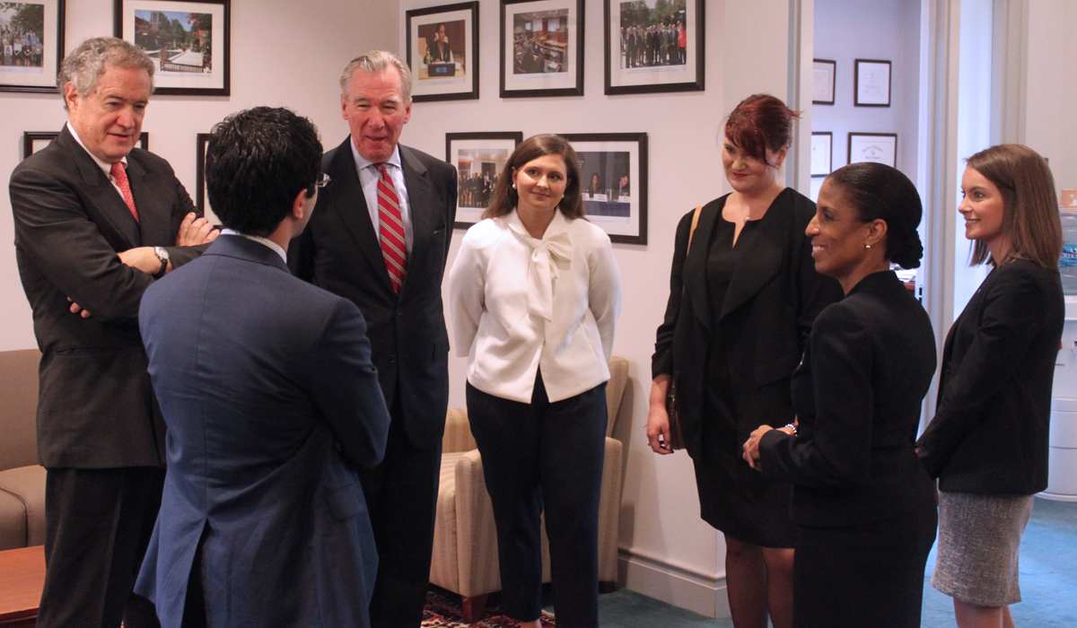 group talking in the Dean's suite