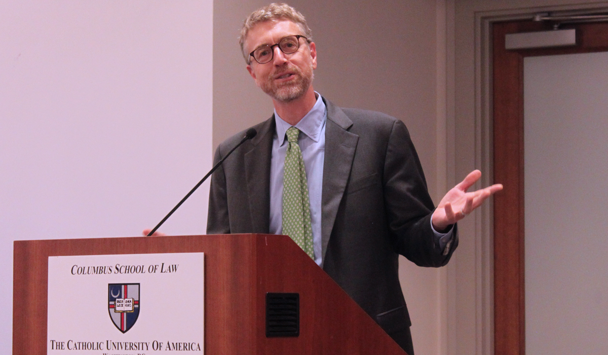 professor Colinvaux's speaking at a podium