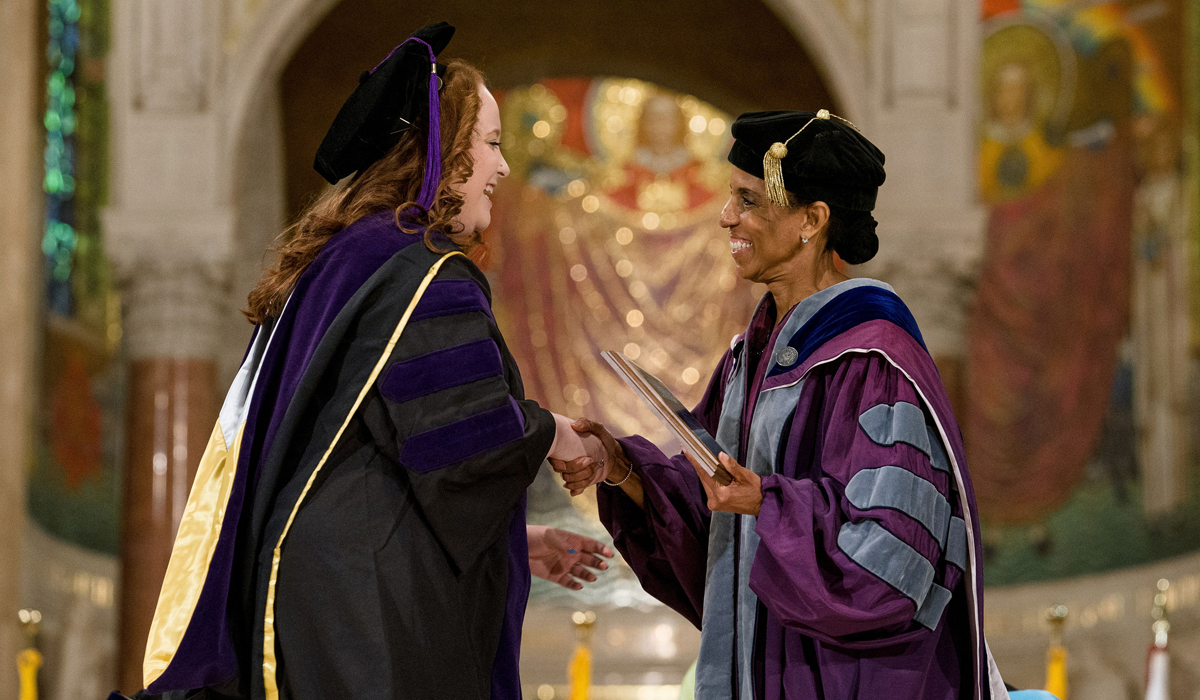 student getting an award at commencement