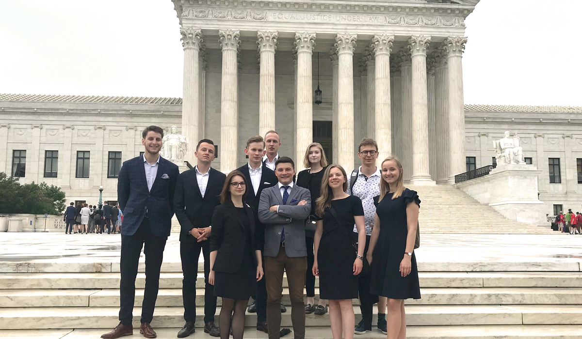 students standing in front of the Supreme Court
