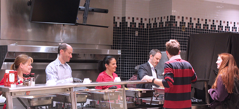 faculty and staff serve breakfast