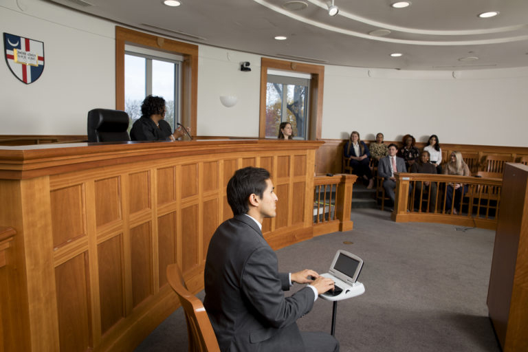 Catholic Law student poses as court reporter for photo shoot 