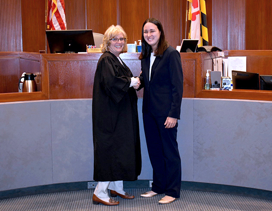 Ulan receiving her USCG Commission from Judge McCally