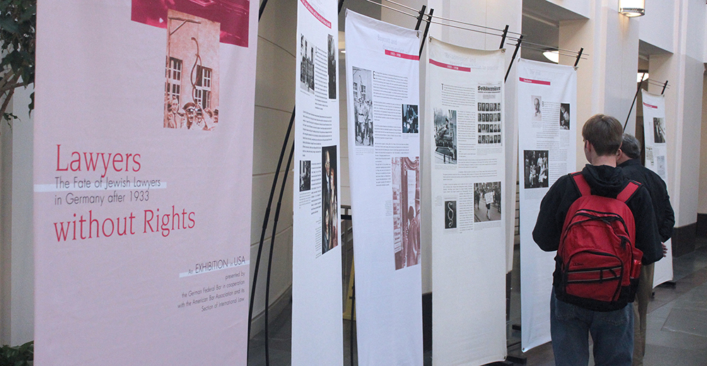 Students viewing the Lawyers Without Rights Exhibit