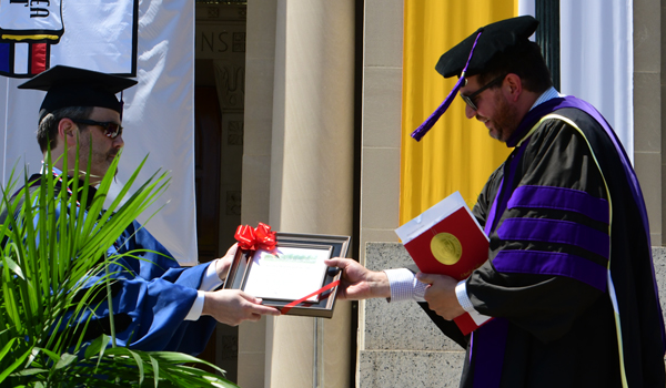 Dean Payne gives Stanley Woodward an award