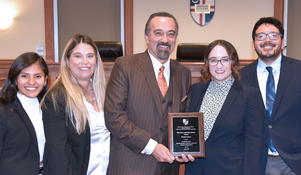 Frank Garza poses for a photo with some LALSA members