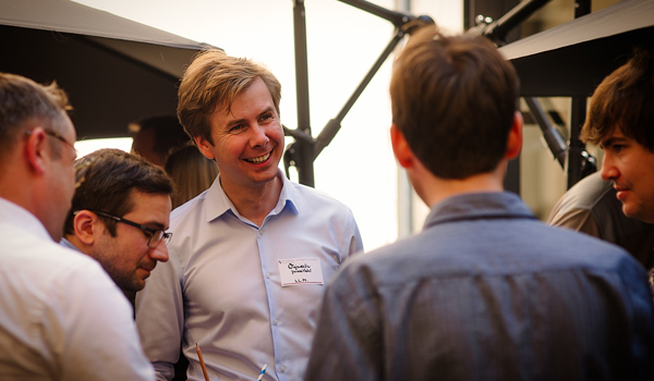 alumni talking at a barbecue