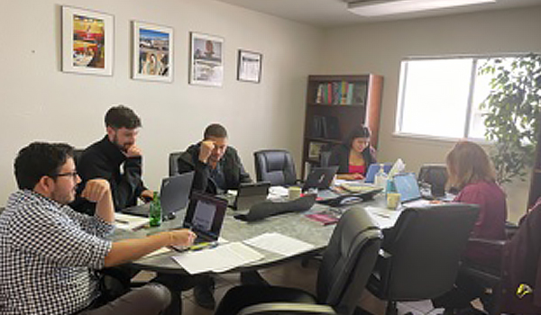 Group of students at a meeting table