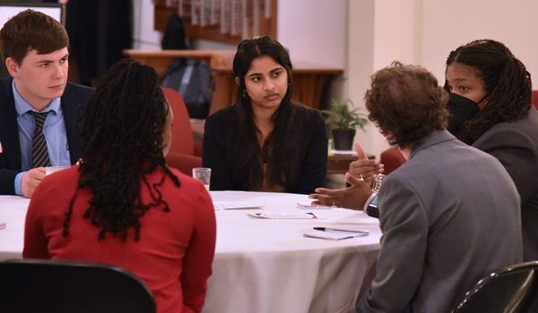 Alumna talking to law students