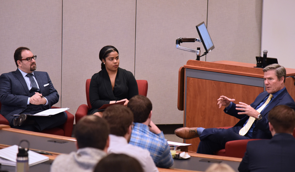 Coonelly talking with students