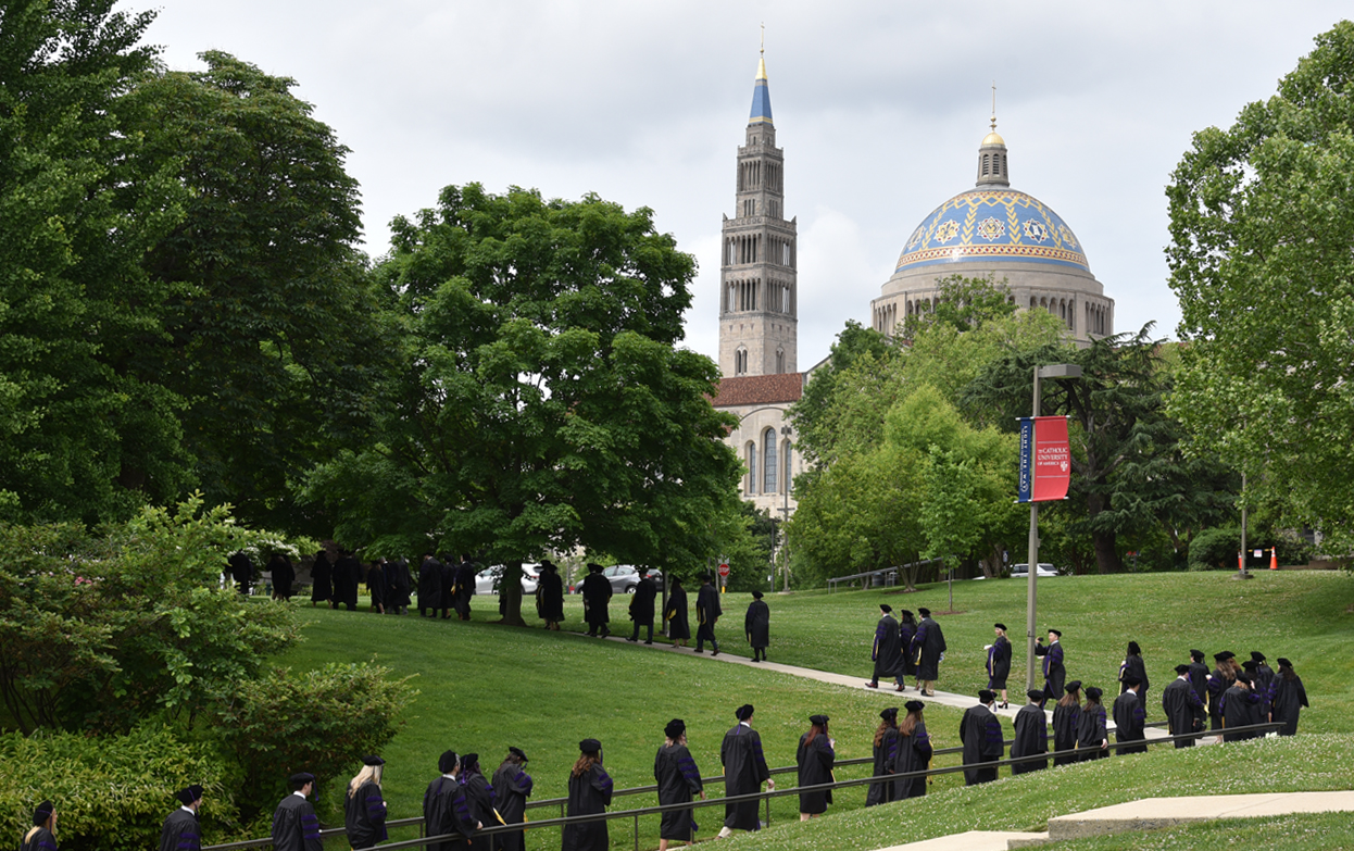 students process to Commencement