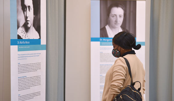 Woman looking at the Jewish Women Lawyers exhibit