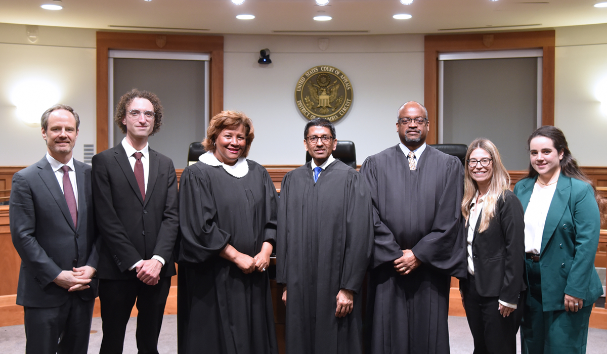 DC Circuit court judges at Catholic Law with Dean Payne and three law students