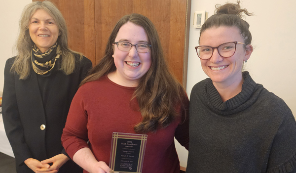 Co-Chairs, Professor Jennifer Paxton and Emily Sobieski, present the award to Natalie.