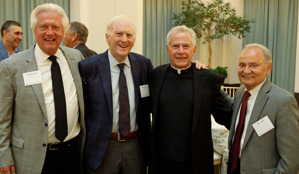 O'Brien with three alumni