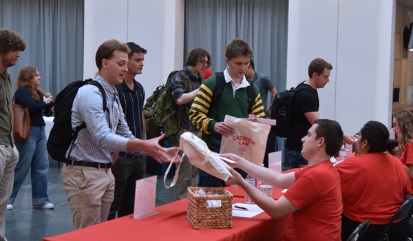 Upper division students welcoming the new students