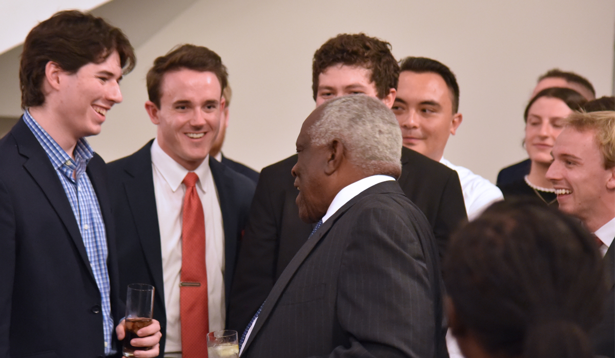 Justice Clarence Thomas talking to law students at Catholic Law