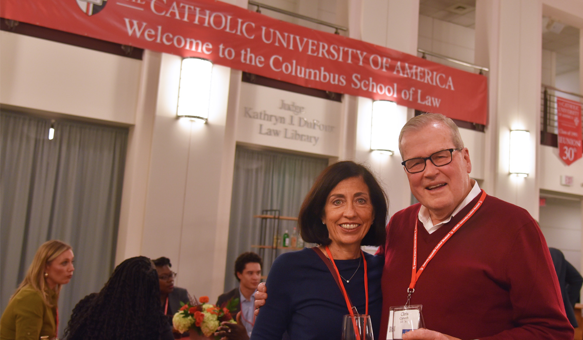 a member of the class of 1975 at reunion with his wife