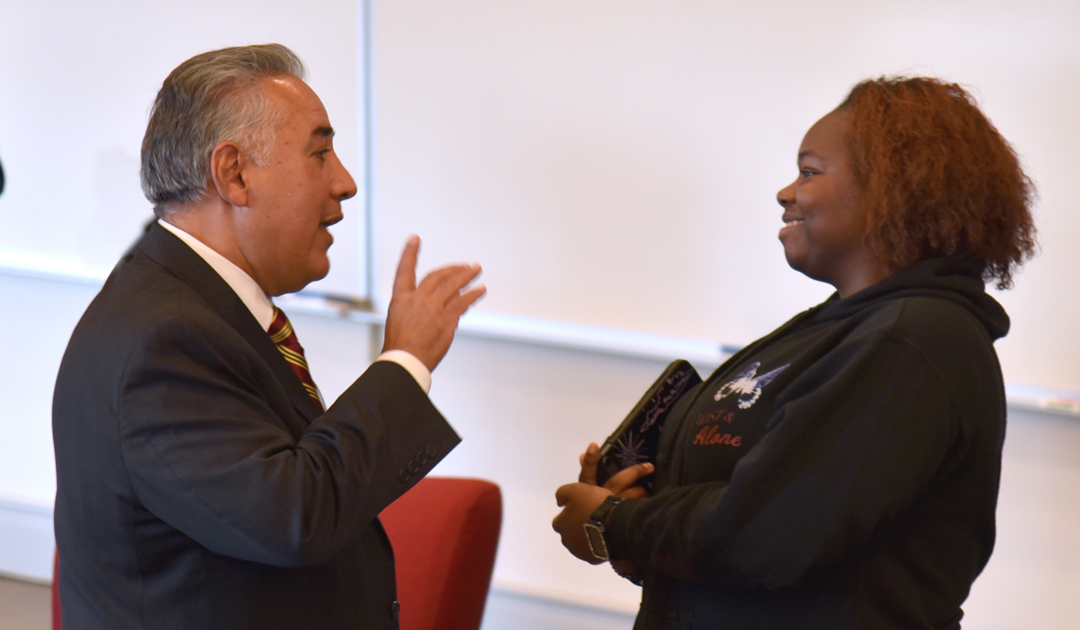 Judge Acosta talking to a law student