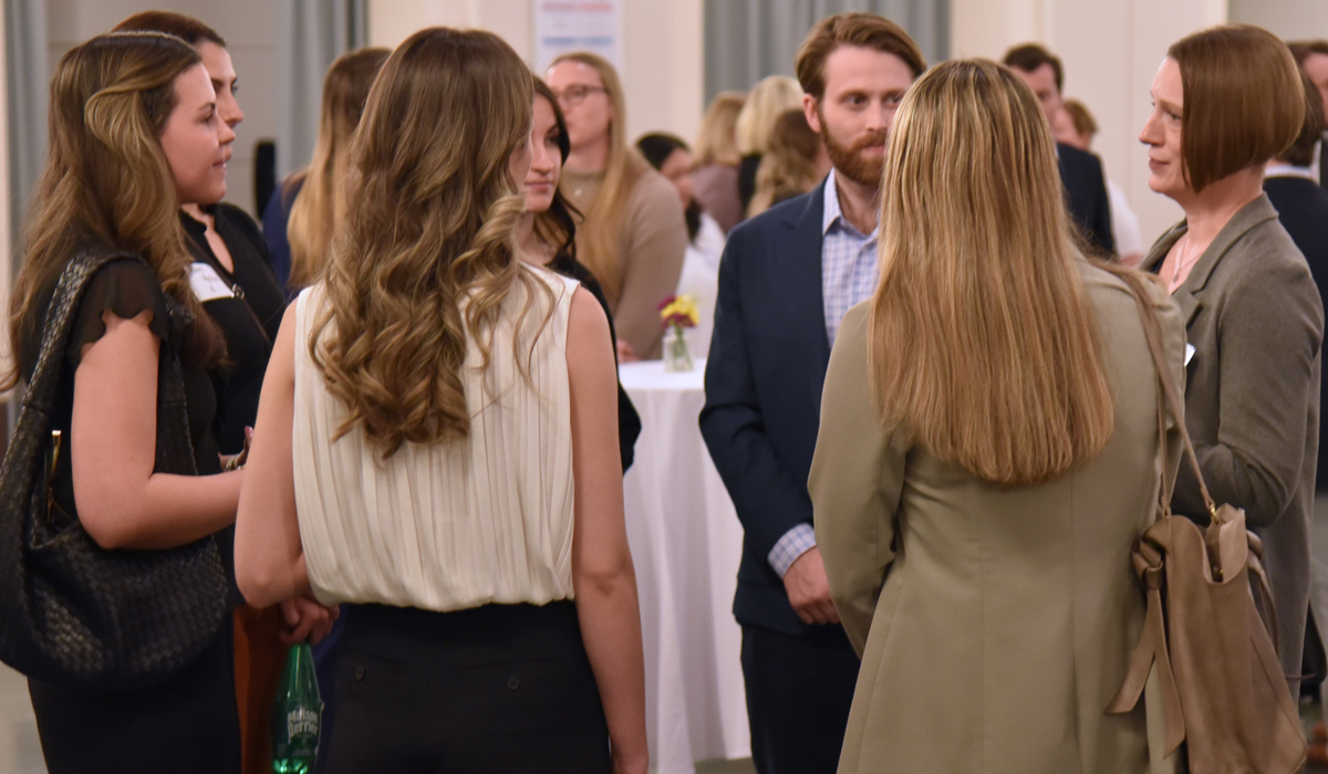 Alumni talking to law students