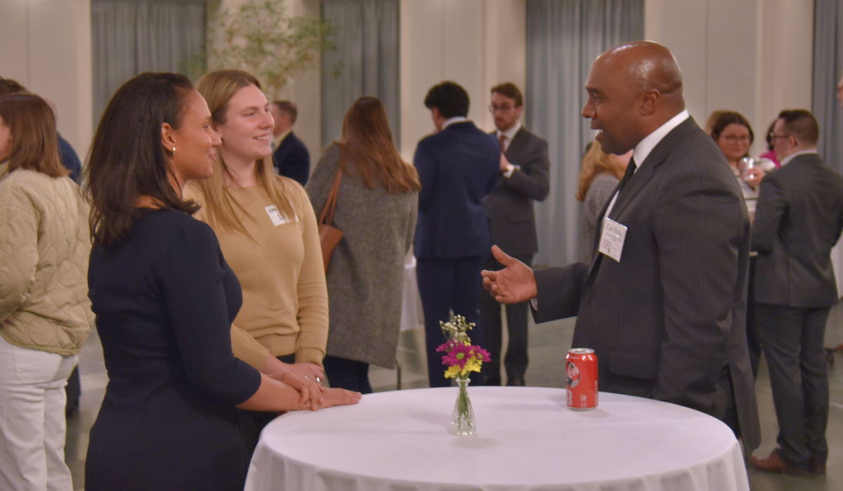 Alumni talking to law students