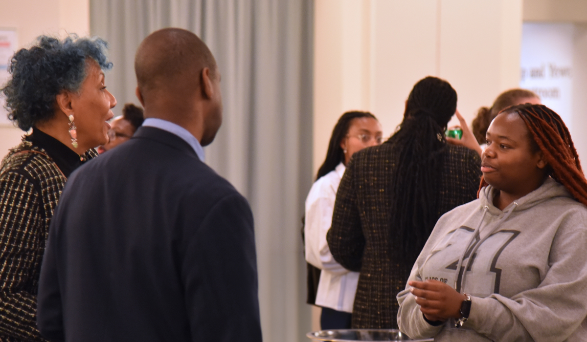 alumni talking to Catholic Law students