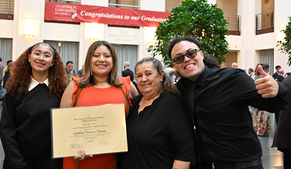 A family at the Certificate Ceremony reception