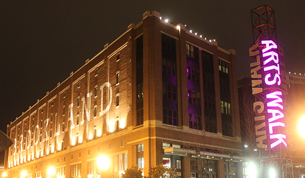 Arts walk sign at night