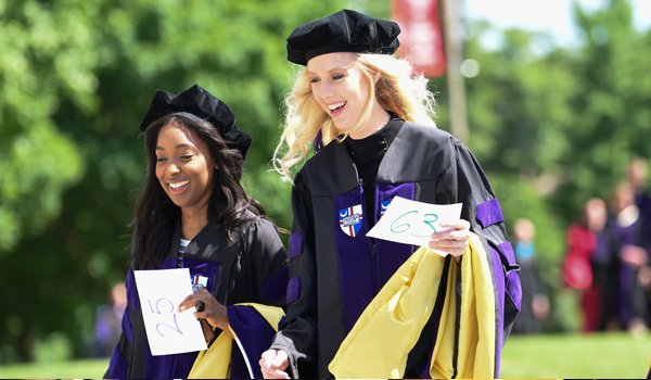 two students at graduation