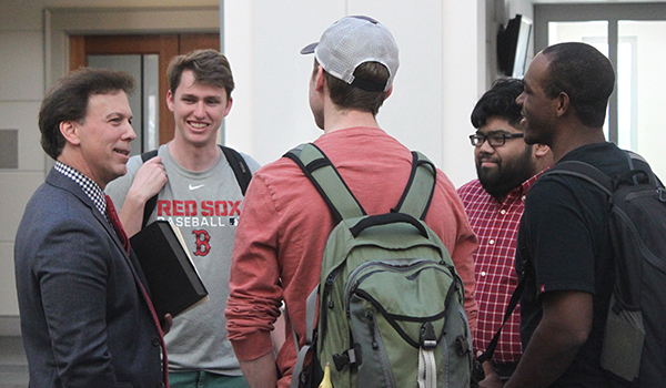 Professor Harmon talking with student