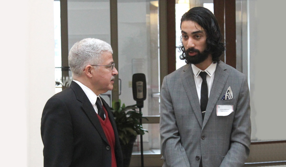 Professor Perez talking to a law student