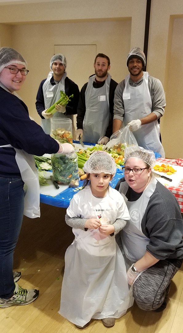 Law Students doing volunteer work in a kitchen