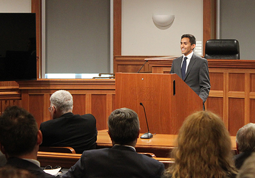 student talking at podium