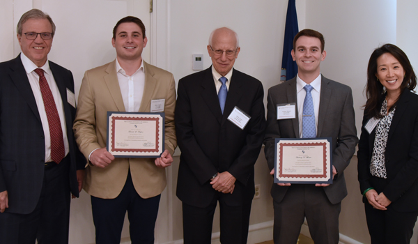 Scholarship recipients with program director and speakers